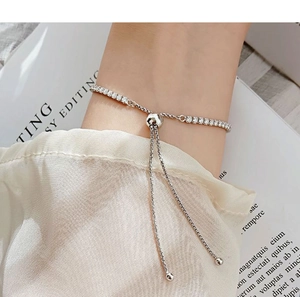 Detail of silver moissanite bracelet with adjustable sliding clasp on a hand