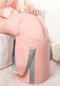Pink portable deep foot bath bag showing zipper closure and gray straps for leg soaking