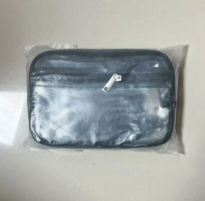 Detail view of a waterproof PVC waist bag inside a clear plastic protective packaging