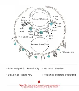 Detail of Western-style necklace and bracelet set with turquoise and cow skull charms