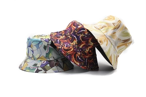 Detailed view of floral bucket hats with abstract, flame, and palm leaf patterns