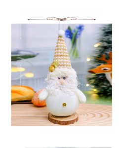 Detail of Christmas gnome with white beard and knitted hat on a natural wood base