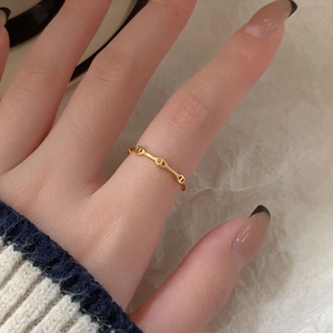 Minimalist 925 sterling silver chain ring in gold finish worn on a finger