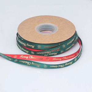 Christmas ribbon rolls in red and green with gold Merry Christmas print and snowflakes