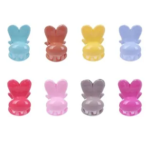 Set of 8 colorful mini rabbit ear hair claws in various bright plastic finishes