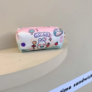 Detail of pink and blue canvas pouch featuring a cute cartoon rabbit and zipper closure