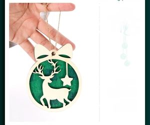 Detail of round wooden Christmas reindeer ornament with green plaid fabric and bow