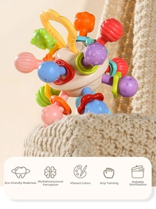 Detail of colorful sensory teething ball with soft textures for baby grip training