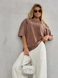 Detail of vintage washed brown oversized cotton T-shirt with retro distressed texture