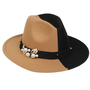Detail of wool fedora featuring khaki-black contrast and pearl flower hatband decoration
