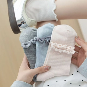 Women cotton crew socks with ruffle trim in pastel colors and vertical ribbed texture
