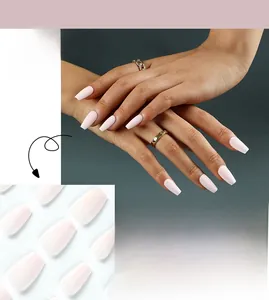 Detail of matte baby pink press-on nails in long coffin shape on hand with #JP2232 tag