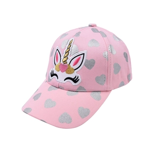 Detail of pink kids baseball cap featuring silver hearts and embroidered unicorn motif