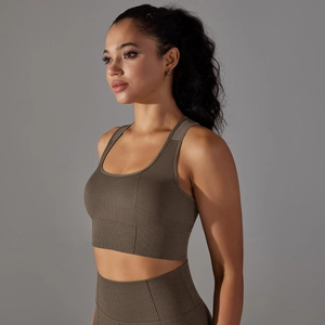 Macro detail of seamless knitted sports bra showing breathable honeycomb mesh texture