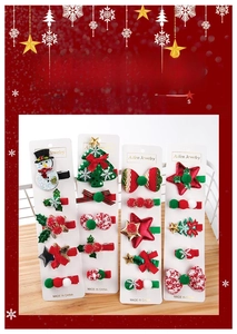 Detailed view of Christmas hair clip set with snowman and tree shapes on paper card