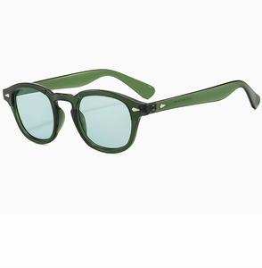 Detail view of green vintage sunglasses frame with sizing specs 45-24-140 on the temple