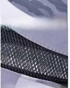 Detailed macro view of camouflaged mesh fabric and sturdy windproof rope on outdoor hat