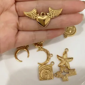 Golden stainless steel charm pendants featuring angel heart, starfish and cross designs