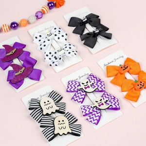 Close-up of Halloween hair clip set with witch hats, ghosts and pumpkins on display cards