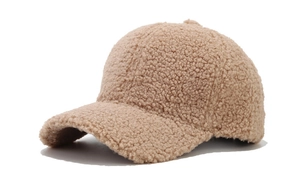 Detailed side view of beige fleece baseball cap showing soft faux lamb wool texture