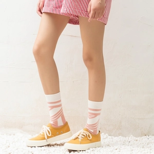 Street style cotton crew socks with pink geometric patterns and yellow canvas sneakers