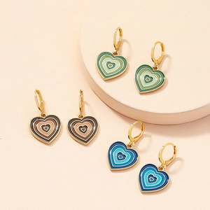 Detailed set of heart enamel earrings in green, brown, and blue with gold hoop clasps