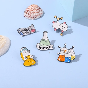 Five-piece science enamel pin set featuring colorful beaker, flask and microscope designs