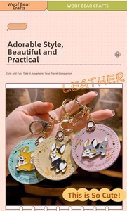 Detailed view of handmade leather Corgi keychains in blue, beige, and purple tones