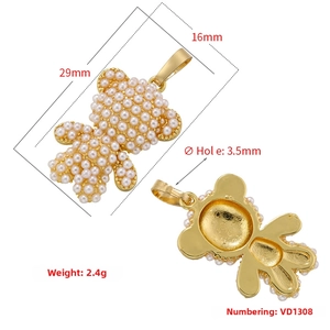 Detailed size chart for a gold bear pendant with white pearls measuring 29mm by 16mm