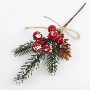 Artificial Christmas branch with red berries, pine needles and cones on white background