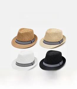 Detail view of four straw fedora hats in brown, beige, white, and black with striped bands