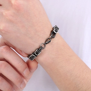 Close-up of vintage Byzantine chain bracelet in titanium steel on male wrist