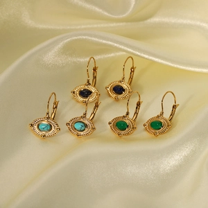Three pairs of vintage 18K gold plated evil eye drop earrings with turquoise stones on satin