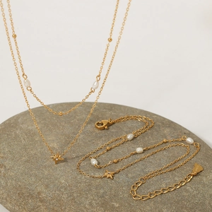 Gold-plated layered stainless steel necklace and bracelet set with pearl and star pendants