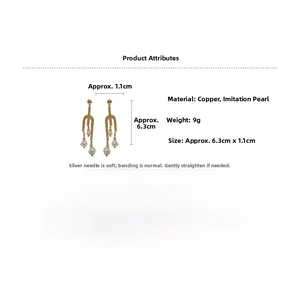 Detail specifications of long gold fork earrings with pearls and dimensions of 6.3cm x 1.1cm