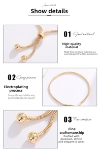 Detail of adjustable gold plated snake chain bracelet showing bead ends and polished nodes