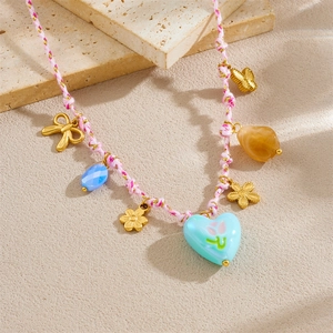 Braided cord necklace with floral pendants and heart tulip charms on stone decor