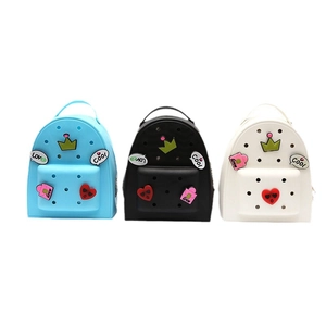 Three colorful silicone cartoon backpacks for girls with decorative charms and air holes