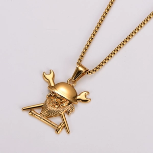 Detail of golden stainless steel skull pendant with boilermaker text on white background
