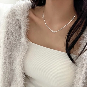 Minimalist 925 sterling silver snake chain necklace featuring delicate bow pendants