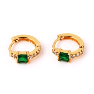 Detail of gold-plated hoop earrings with square emerald gemstone and clear accents