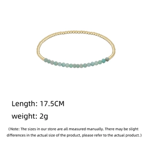 Detail shot of amethyst beaded bracelet with gold accents showing 17.5CM length and 2g weight