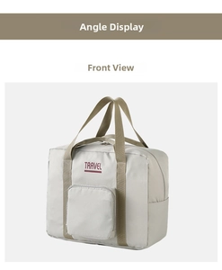 Detail of light grey travel bag with durable straps and TRAVEL lettering on front