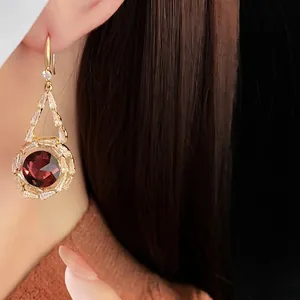 French luxury gold drop earrings with a round red crystal and sparkling zircons for women
