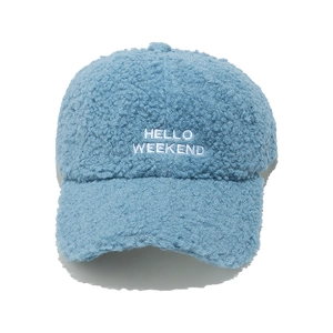 Close-up of HELLO WEEKEND embroidery on light blue plush fleece winter baseball cap