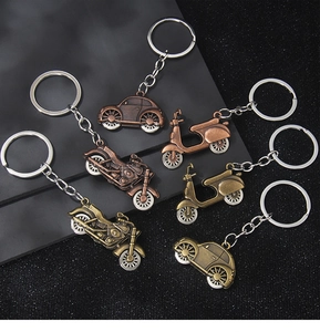 Detailed set of six bronze vintage vehicle keychains featuring cars and motorcycles