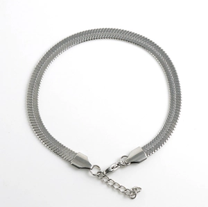 Detail of silver herringbone flat blade chain bracelet with lobster clasp and extender