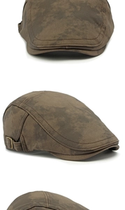 Dettaglio della coppola vintage tie-dye con fibbia in ottone e trama in tessuto twill