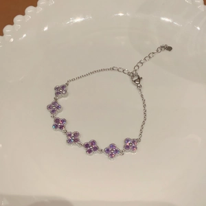 Elegant silver flower chain bracelet with sparkling purple zircons and adjustable lobster clasp