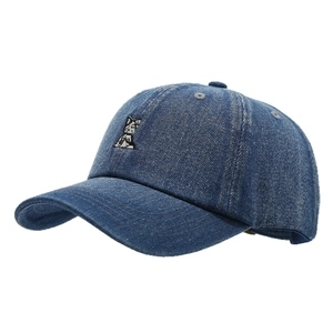 Classic washed denim baseball cap with small white dog embroidery on navy blue cotton